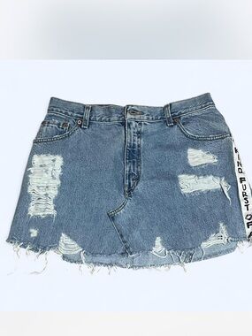 Furst of kind distressed denim mini skirt.